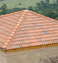 Tuscan tiles with 3-way apex and gable roll with hip starter